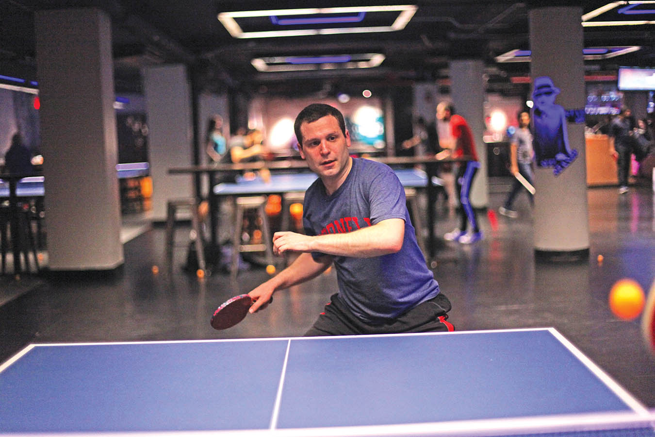 Dr. Matthew Simon practices at a table tennis club in Manhattan.