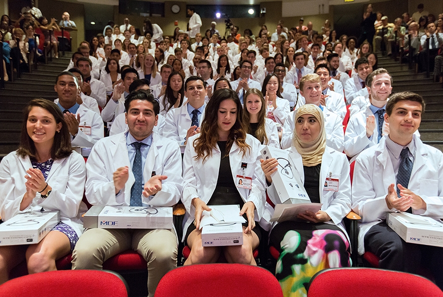 From left to right, first-year students Debra Abramov, Julio Alvarez, Lauren Antrim, Hanan Baker and Paul Barone, pictured with stethoscopes donated by the Buster Foundation's Paul F. Miskovitz, M.D. '75 Stethoscope Fund for Medical Students and generous alumni. The foundation also provided the students' white coats. Photo: Monika Graff/Getty Images/WCMC