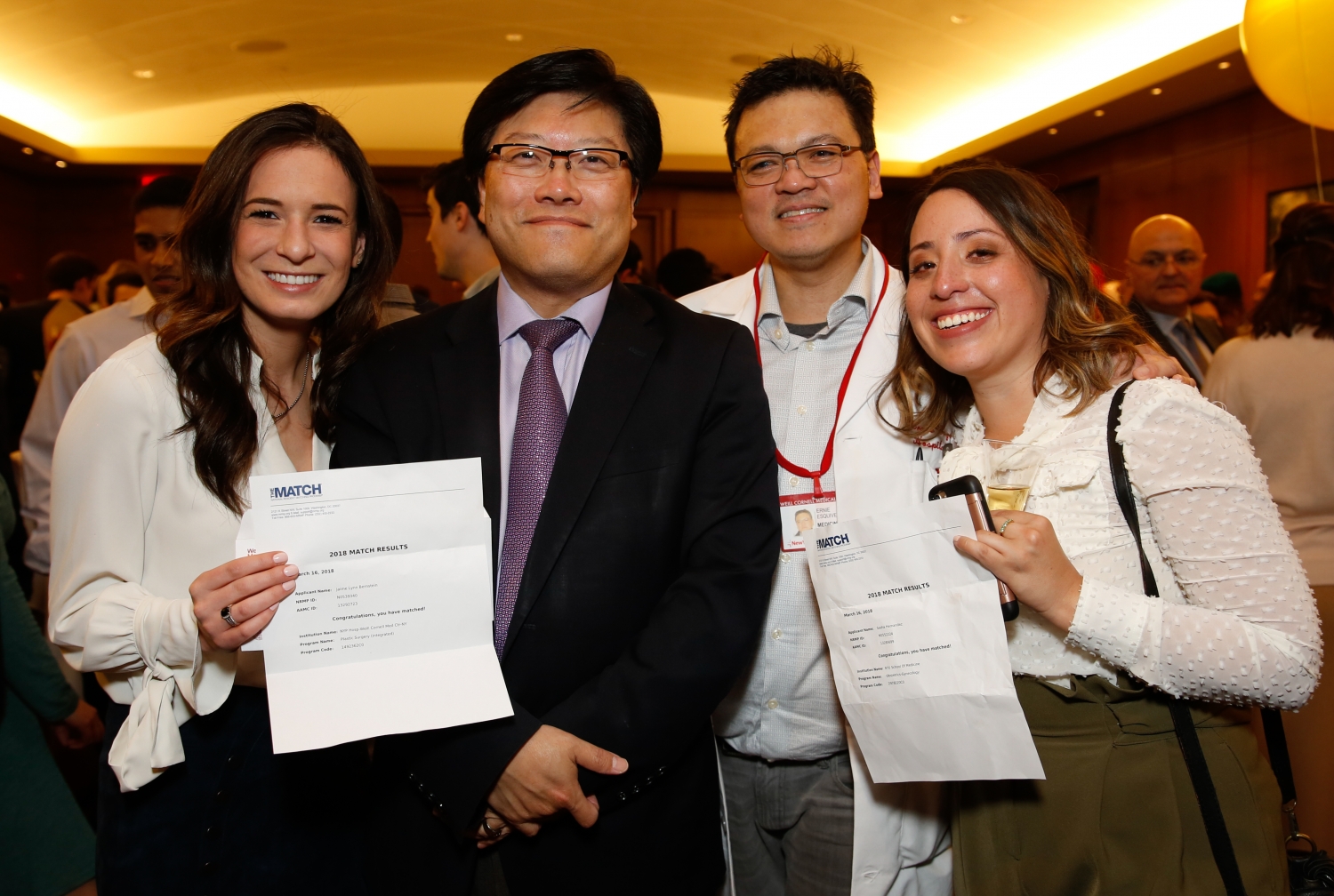 Graduating medical students Jaime Bernstein (left) and Sasha Hernandez (right) with Dr. Augustine M.K. Choi and Dr. Ernie L. Esquivel at this year’s Match Day on March 16. All photos by Ashley Jones. 