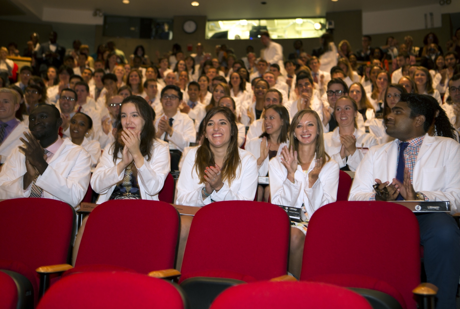 The first-year students in the Class of 2018 receive their white coats during the White Coat Ceremony 2018. Joshua Agjei, Rhiannon Aguilar, Nicole Aguirre, Sydney Ariagno and Sanjeethan Baksh 