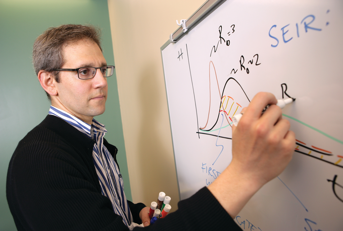 Man writing on a white board