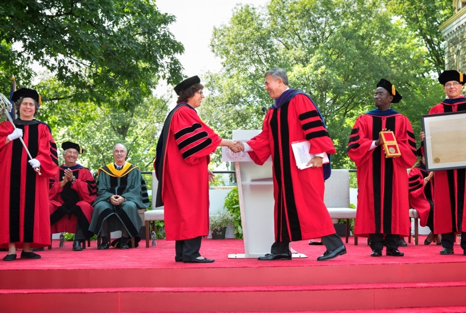 President Martha E. Pollack is greeted by Robert S. Harrison '76, chairman of the Cornell Board of Trustees, at Pollack's installation ceremony Aug. 25 on the Arts Quad.