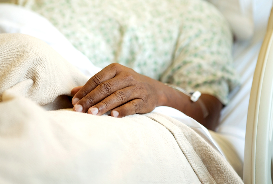 elderly Black person in hospital bed
