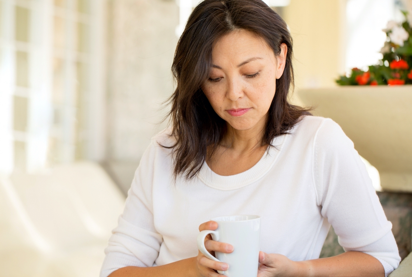 a woman holding a tea cup