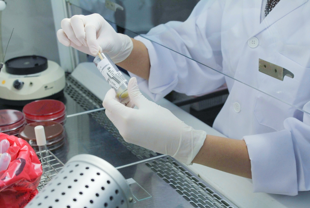 A scientist in a lab doing research. Credit: Shutterstock