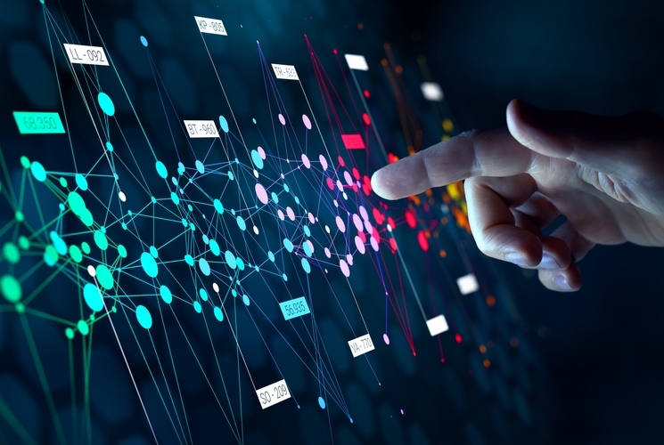 finger pointing to colorful image of networks