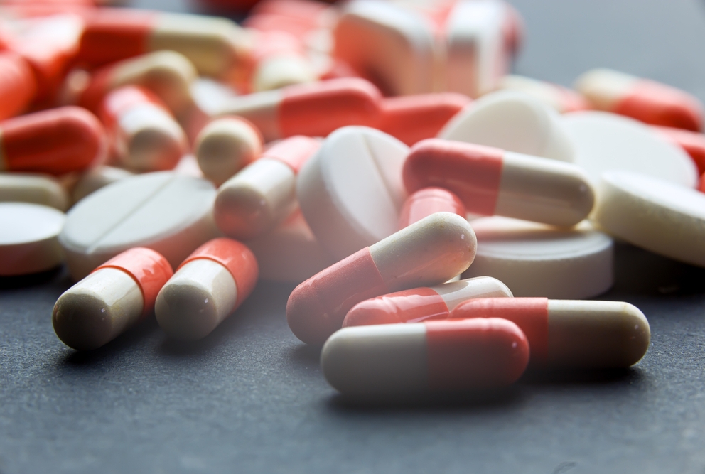 a bunch of pills scattered on a table