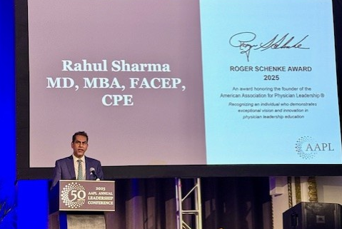 A man at a podium accepting an award