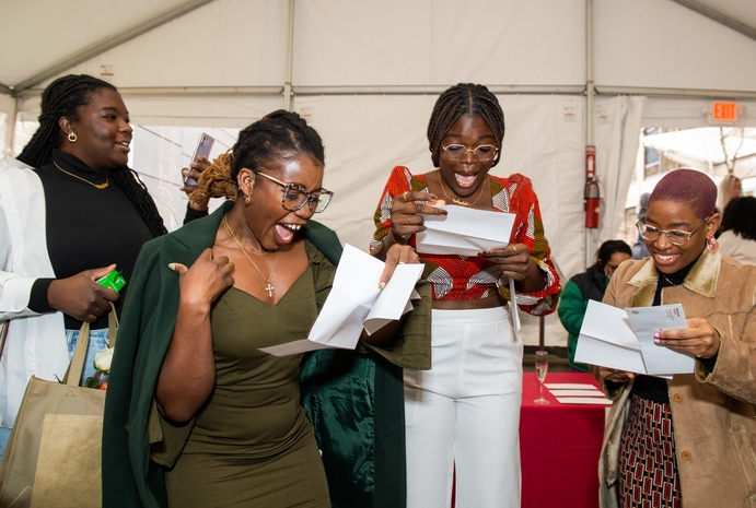 three women celebrating good news