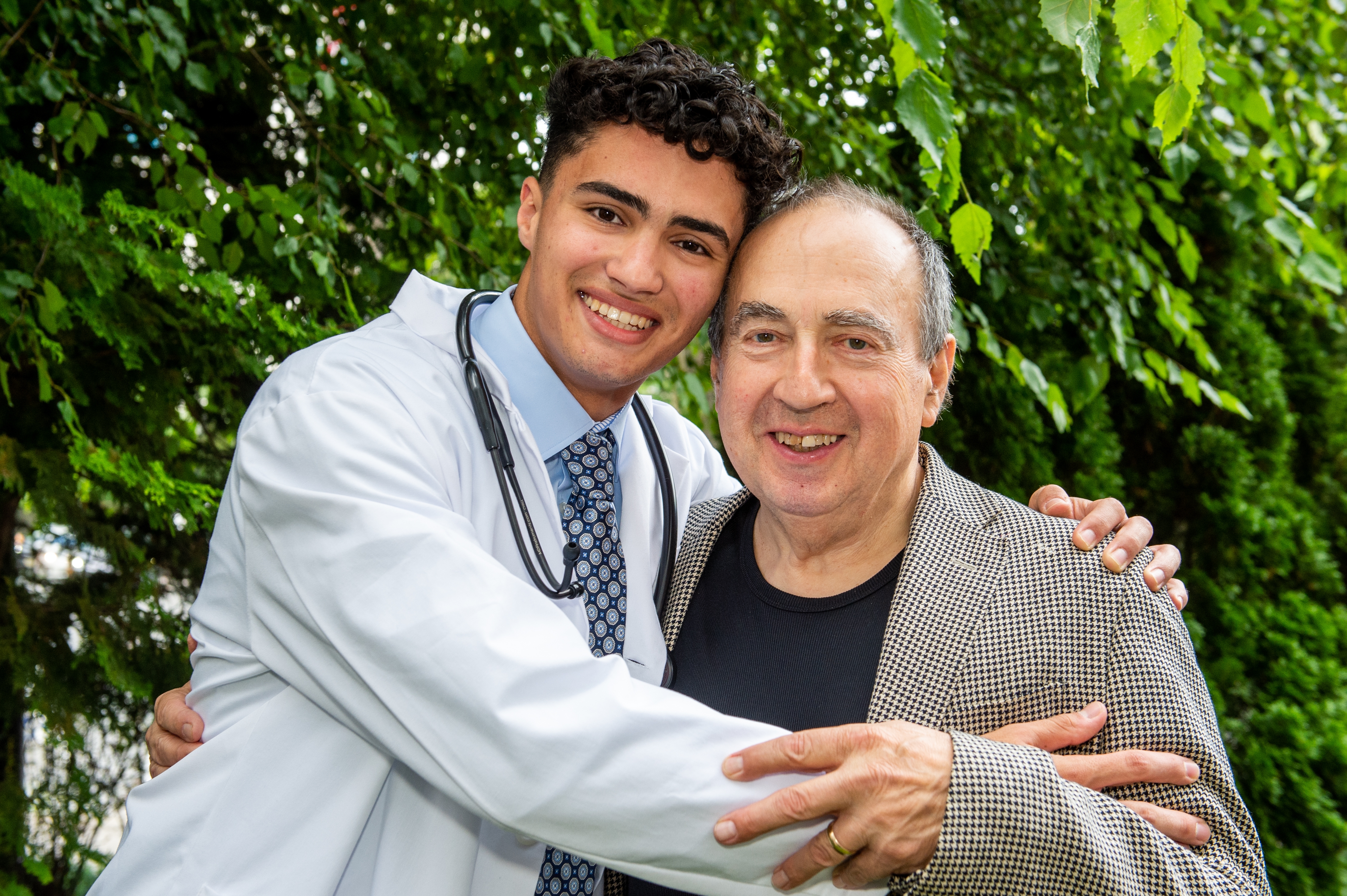 A son and his father hugging