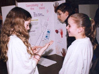 East Side Middle School students present and discuss their projects with fellow students, mentors and judges.