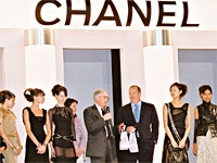 Chanel models with Chanel president Arie Kopelman and Ron Frasch, president of Bergdorf Goodman.