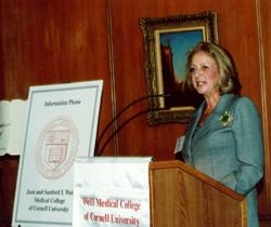 Daisy Soros welcomes guests to the "Information Please" breakfast on "Drug Interactions: Beyond the Warning Label."