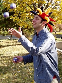 Second-year student Joseph Mancias entertains the kids with his juggling skill.