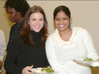 Sarah Wieckowicz and Natasha Gadwah of the Department of Finance smile at lunch