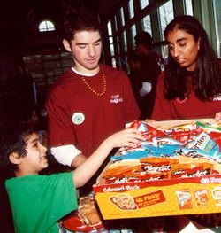 Getting the snacks ready are first-year students Joshua Levinger and Minal Patel (director of Camp Phoenix).