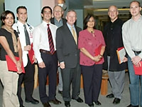 Dr. Antonio Gotto poses with 2003 Art Show winners Sahar Ahmad, Doug Weine, Edward Nejat, Alan De Mayo, Sunandra Parikh, John Haubrich and Tom Graves.