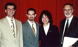 Gregory St. John, recipient of the 2001 Graduate School Award of Excellence, with Dean Hajjar, Francoise Freyre and Dr. Joel Pardee