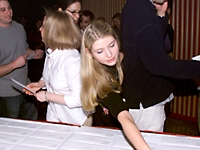 Catherine Grossman reaches for the envelope bearing her "match" results. She will remain at NewYork Weill Cornell for postgraduate training in general surgery.