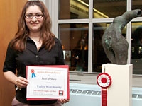 Yadira Weirshousky displays her statue "Le Gran Desesperacion," winner of the Golden Harvest Award