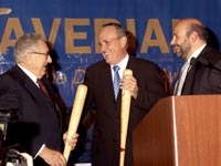 Dr. Rock Positano emceeing the 3rd annual Joe DiMaggio Award Gala, at which former Mayor Rudolph Giuliani (center) received the 2002 Joe DiMaggio Award. Henry Kissinger was the first recipient of the Joe DiMaggio Award, presented in 2000.