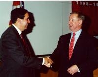 Dr. Frank Chervenak is congratulated by Dean Antonio Gotto, who announced Dr. Chervenak's appointment at Ob/Gyn Grand Rounds.