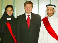 President Lehman with first-year WCMC-Q students Noor Al-Khori and Saoud Al-Shamari at inaugural ceremonies in Qatar