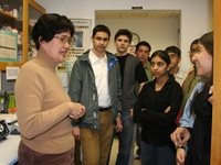 Dr. Aihao Ding gives students a tour of her lab