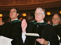 Drs. Peter Scardino, E. Darracott Vaughan, with Estomih Mtui and Rubin Cooper, rededicate themselves to the principles expressed in the new oath.