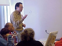 Jeremy Seto leads a PBL discussion with teachers looking at the diagnosis of Huntington's disease.