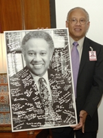 Dr. Ballard with a gift from the Class of 2009.
