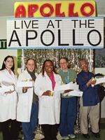 It's showtime! Employees stop in front of a façade of the Apollo Theater before digging into their lunches.