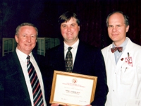 Dr. Antonio Gotto and Dr. Charles Bardes present Dr. Philip Leopold with the Charles L. Bardes, M.D. Teaching Prize.