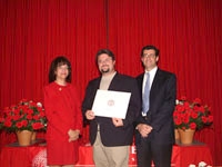 Francoise Freyre and Dr. David Hajjar congratulate John Biggins, a recipient of the 2004 Julian R. Rachele Prize.