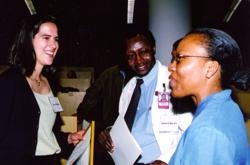 Rebecca Miksad, who worked on a project in Kenya, and Rotonya McCants, who worked in Sweden, with Dr. Estomih Mtui