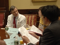 Dr. Oliver Fein, associate dean of affiliations, speaks with the group's translator, Yu-Ling Qiao