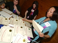 Judges Michael Bruno, Michelle Tourigny, and Alicia Reid sorted through awards and certificates for the winners.