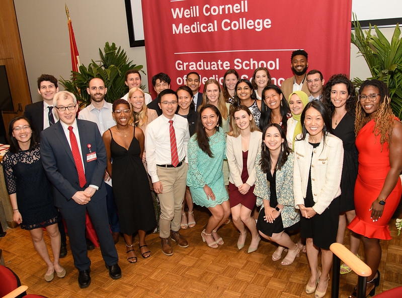 graduating medical students pose together