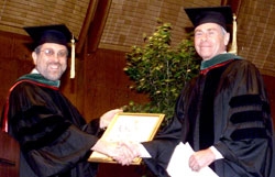 Dr. Gerald Mandell receives the Medical College's Alumni Award of Distinction, presented by Dr. Paul Miskovitz, '75, president of the Cornell University Weill Medical College Alumni Association.