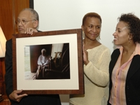 Dr. Ballard, with wife, Eleanor, and daughter, Tracy, accepts a gift from the Department of Academic Affairs.