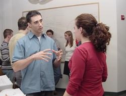 Dr. Luis Quadri talks about his research on tuberculosis with first-year graduate student Tia Maiolatesi.