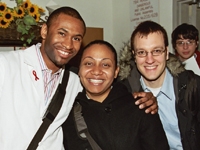 A few friends enjoying a moment together during a crowded Employee Appreciation Day.