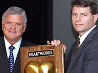 Dr. Leonard Girardi receives the "Hero with a Heart Award," presented by Dr. O. Wayne Isom