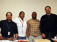 Staff from the Finance Department Joseph Mason, Beverly Saunders, Pierre Voltaire, and Derek Spears savor the day and the food.