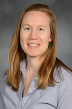 a woman smiling for a portrait