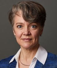 a woman posing for a headshot photo