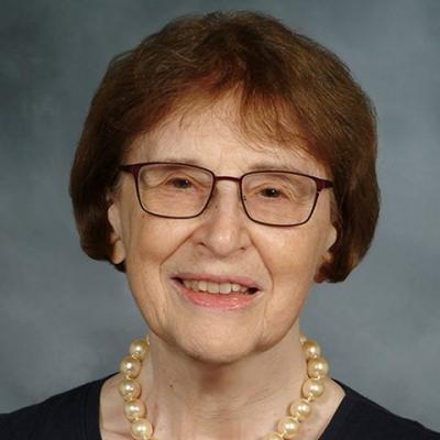 a woman posing for a headshot