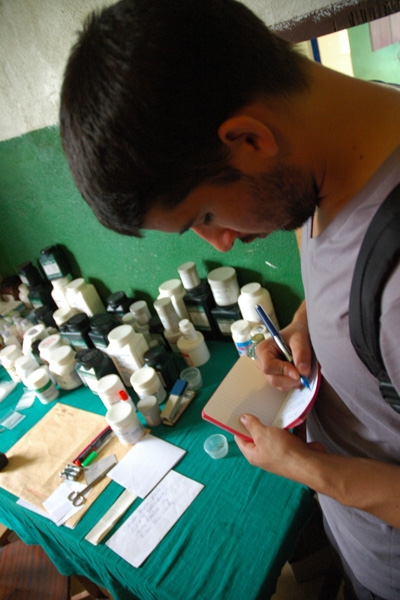 Martha Tubman Memorial Hospital in Zwedru, Liberia: Carlo Canepa takes notes on the availability of drugs.