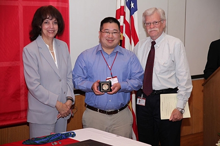 2013 Distinguished Graduate Student Commencement Speaker Jonathan Bourne with Dr. Peter Torzilli and Francoise Freyre 