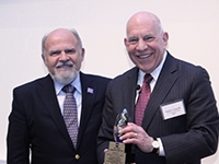 Dr. Ron Crystal, right, receives the Sten Eriksson Award from Alpha-1 Foundation CEO John Walsh during a ceremony April 20 at UMass Medical School, Worcester, Mass. Dr. Ron Crystal receives Sten Eriksson Award from Alpha-1 Foundation CEO John Walsh